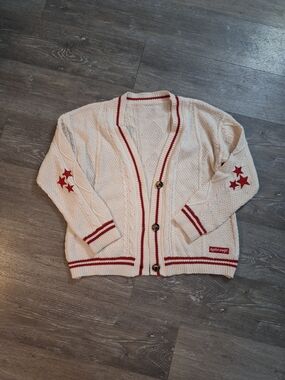 Cream Cable-Knit Cardigan with Red Trim and Star Accents